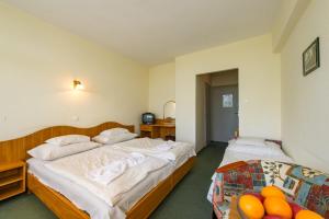 Posteľ alebo postele v izbe v ubytovaní Hotel Nostra