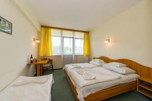 Posteľ alebo postele v izbe v ubytovaní Hotel Nostra