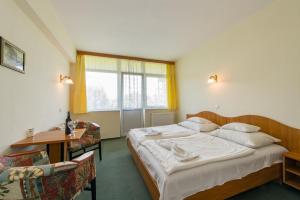 Posteľ alebo postele v izbe v ubytovaní Hotel Nostra