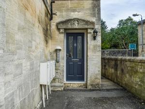 a blue door on the side of a building at Flat 3 Avon Villa in Bradford on Avon