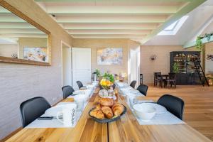 a long table with a bunch of food on it at Marc's Flat - Calm & Cosy in Nantes