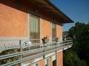 a balcony of a building with potted plants on it at Il Ciambellino in Santo Stefano di Magra