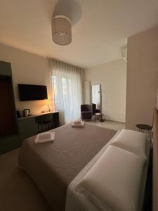 Postel nebo postele na pokoji v ubytování Annunziatella Suite & Rooms