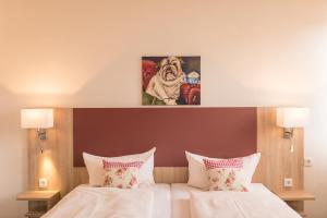 Postel nebo postele na pokoji v ubytování Hotel Leander