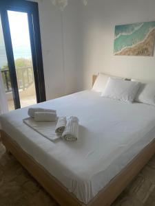 Postel nebo postele na pokoji v ubytování Konstantinos Polichrono Residence