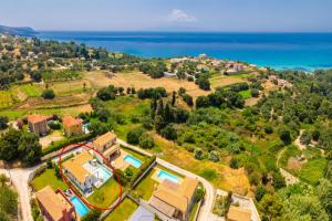 an aerial view of a house with a pool at Villa Kira in Trapezaki