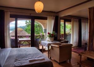 Katil atau katil-katil dalam bilik di Birdnest Resort