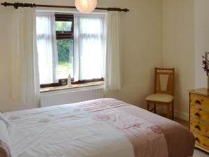 En eller flere senge i et værelse på Forge Cottage + 7 billeder