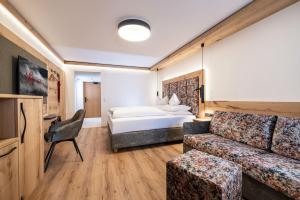 Letto o letti in una camera di Hotel Edenlehen