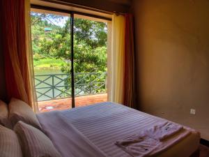 Katil atau katil-katil dalam bilik di Birdnest Resort
