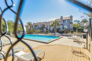 a view of a swimming pool in a apartment at Sunny Large Two Bedroom Townhouse - Pool in Pensacola