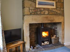 TV a/nebo společenská místnost v ubytování The Cottage