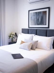 Postel nebo postele na pokoji v ubytování Divina Tower Apart Hotel