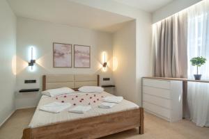 Ένα ή περισσότερα κρεβάτια σε δωμάτιο στο Papanikolis Apartments