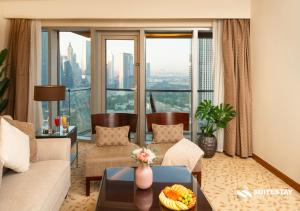 a living room with a view of a city at Fashion Avenue - Dubai Mall in Dubai