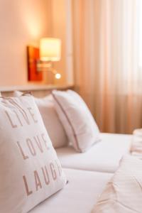Postel nebo postele na pokoji v ubytování Hotel Leander