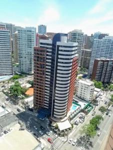 an aerial view of a city with tall buildings at Flat Acolhedor e Familiar in Fortaleza