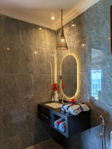 a bathroom with a sink and a mirror at Lala Land Lodge in Kizimkazi +87 photos