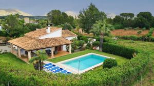 an aerial view of a house with a swimming pool at Villa GERANIOS in El Port