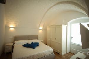 En eller flere senge i et værelse på Casa Maristella