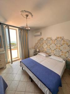 Postel nebo postele na pokoji v ubytování Hotel 4 Stagioni