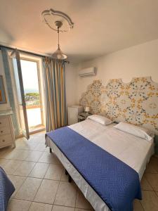 Postel nebo postele na pokoji v ubytování Hotel 4 Stagioni