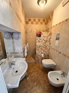 Koupelna v ubytování Hotel 4 Stagioni