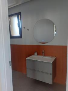 a bathroom with a sink and a mirror at Villa Dalesco in Leverano +58 photos