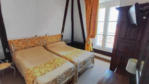 Postel nebo postele na pokoji v ubytování Hotel Montsegur