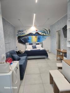 a living room with a bed and a couch at Margot Sorrento house e spa in Sorrento