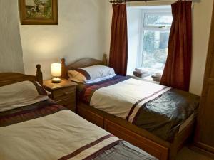 Postel nebo postele na pokoji v ubytování Michill Cottage