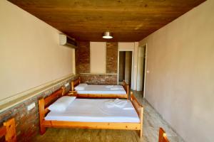 Postel nebo postele na pokoji v ubytování Menis Haus Rooms