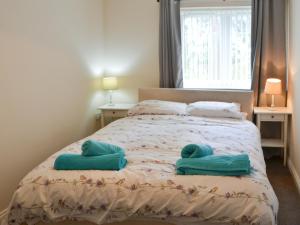 Voodi või voodid majutusasutuse Maisie's Cottage toas +7 fotot