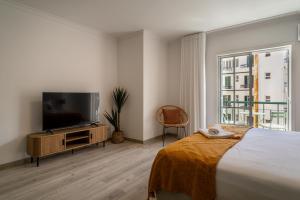 TV a/nebo společenská místnost v ubytování Funchal Heart Studio