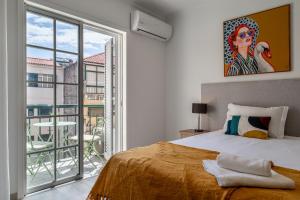 Postel nebo postele na pokoji v ubytování Funchal Heart Studio + 9 fotografií