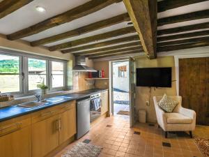 Kuchyň nebo kuchyňský kout v ubytování Ty-Ucha Cottage