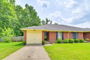 a brick house with a yellow garage at Family Home with Ping-Pong and Fire Pit in Lexington in Lexington
