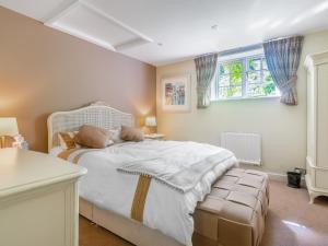 Ένα ή περισσότερα κρεβάτια σε δωμάτιο στο Orchard Cottage