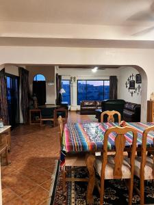 a living room with a table and a couch at The House of Angels in Las Conchas