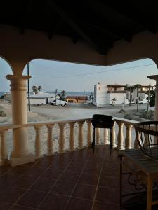 a balcony with a white railing and a view of the ocean at The House of Angels in Las Conchas