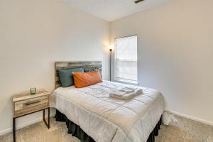 a small bedroom with a bed and a window at 10 Mi to Keeneland Family Home with Deck and Yard in Lexington