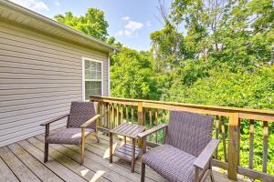 two chairs and a table on a deck at 10 Mi to Keeneland Family Home with Deck and Yard in Lexington