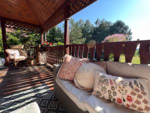 Imagen de la galería de Gietki - dom wypoczynkowy na wyłączność z linią brzegową, en Piasutno Ludwy