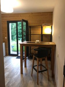 a dining room with a table and a chair at Independent studio in a chalet in Mont-Saxonnex