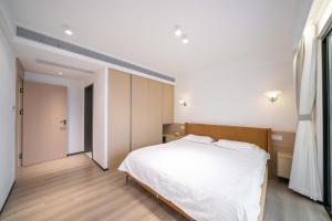 Ένα ή περισσότερα κρεβάτια σε δωμάτιο στο ZHome-Modern 3 bedrooms apartment - near NanJing Road
