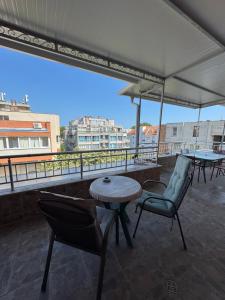 a patio with chairs and a table on a roof at VP Palazzo Nesebar in Nesebar