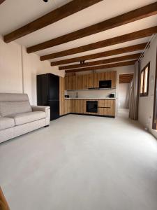 a living room with a couch and a table at Casa Bel - Apartment 6 in Miami Platja +14 photos