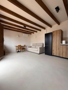 a living room with a couch and a table at Casa Bel - Apartment 6 in Miami Platja