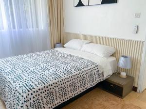 Postel nebo postele na pokoji v ubytování kololo's gem