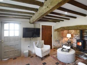 TV a/nebo společenská místnost v ubytování Ty-Ucha Cottage